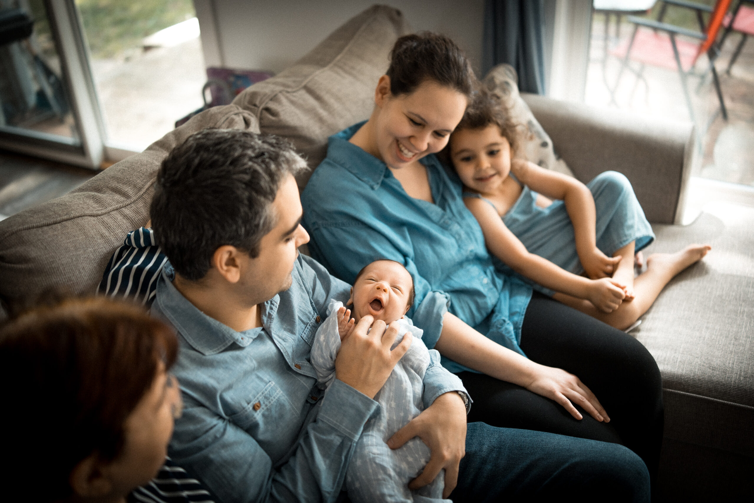 Family portrait of a couple and children at home by Light By Zoey Photography in Champaign, IL