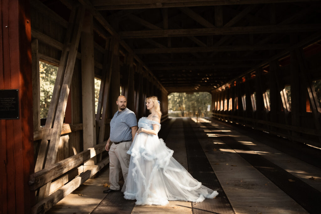 Couple portrait inside the covered bridge at Lake of the Woods Forest Preserve in Mahomet, Illinois.