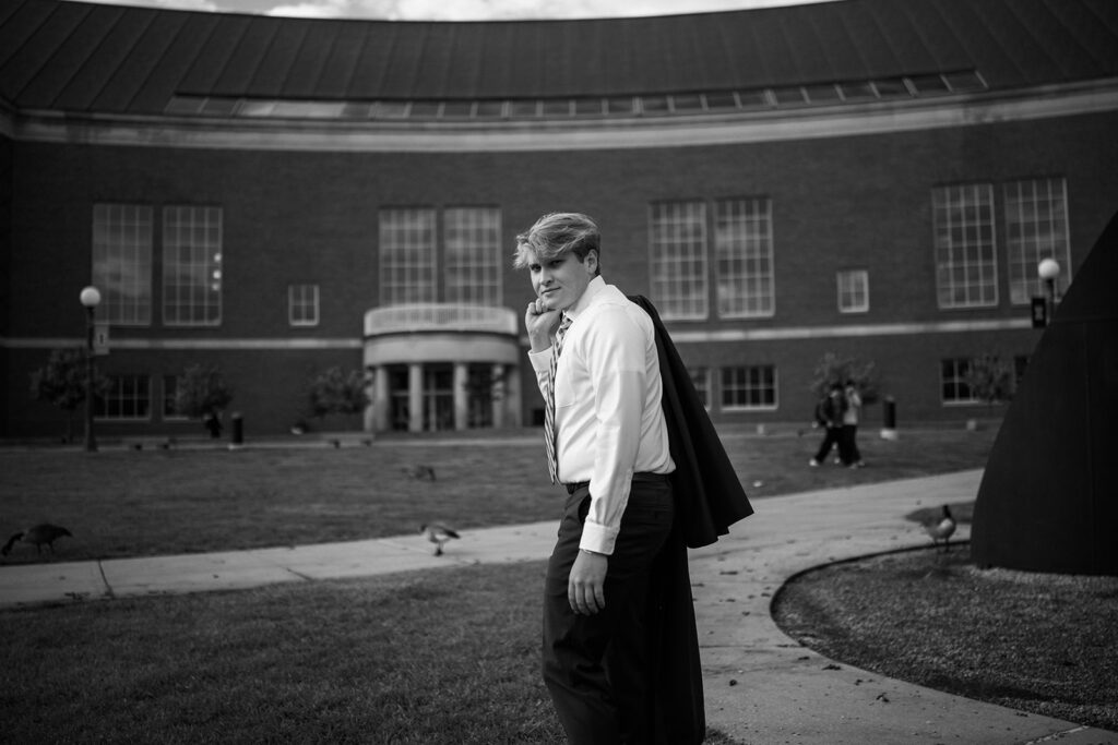 University of Illinois senior portrait in front of State Farm Center in Champaign, Illinois