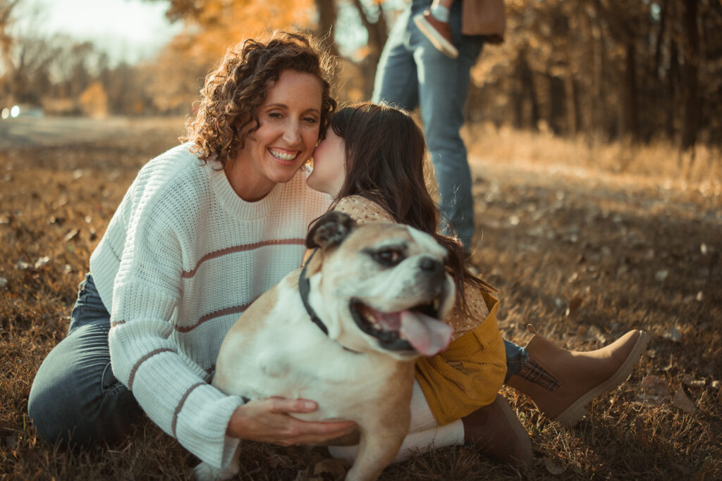 Family gathered outdoors at River Bend Forest Preserve in Mahomet, IL, enjoying a sunny autumn day, captured by Light By Zoey Photography, Champaign, IL."