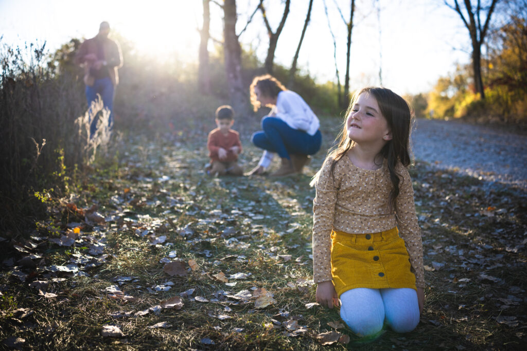 : "Family enjoying time by the lake at River Bend Forest Preserve in Mahomet, IL, with a golden sunset, captured by Light By Zoey Photography, Champaign, IL."