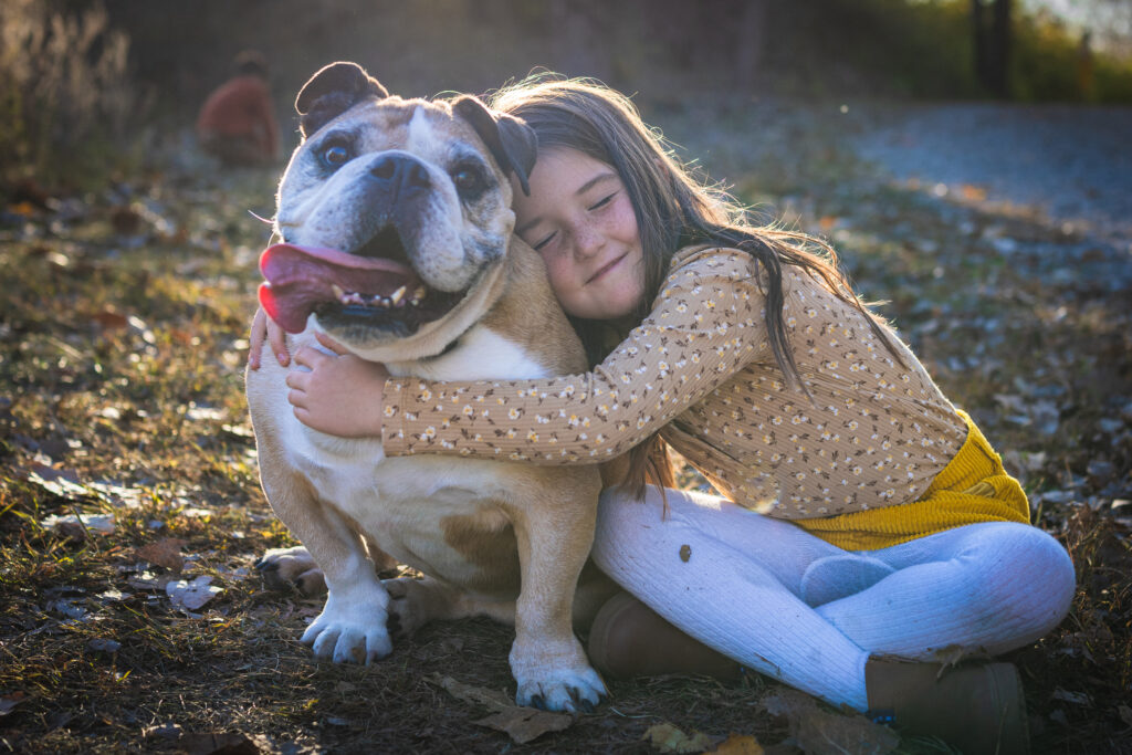 Family gathered outdoors at River Bend Forest Preserve in Mahomet, IL, enjoying a sunny autumn day, captured by Light By Zoey Photography, Champaign, IL.