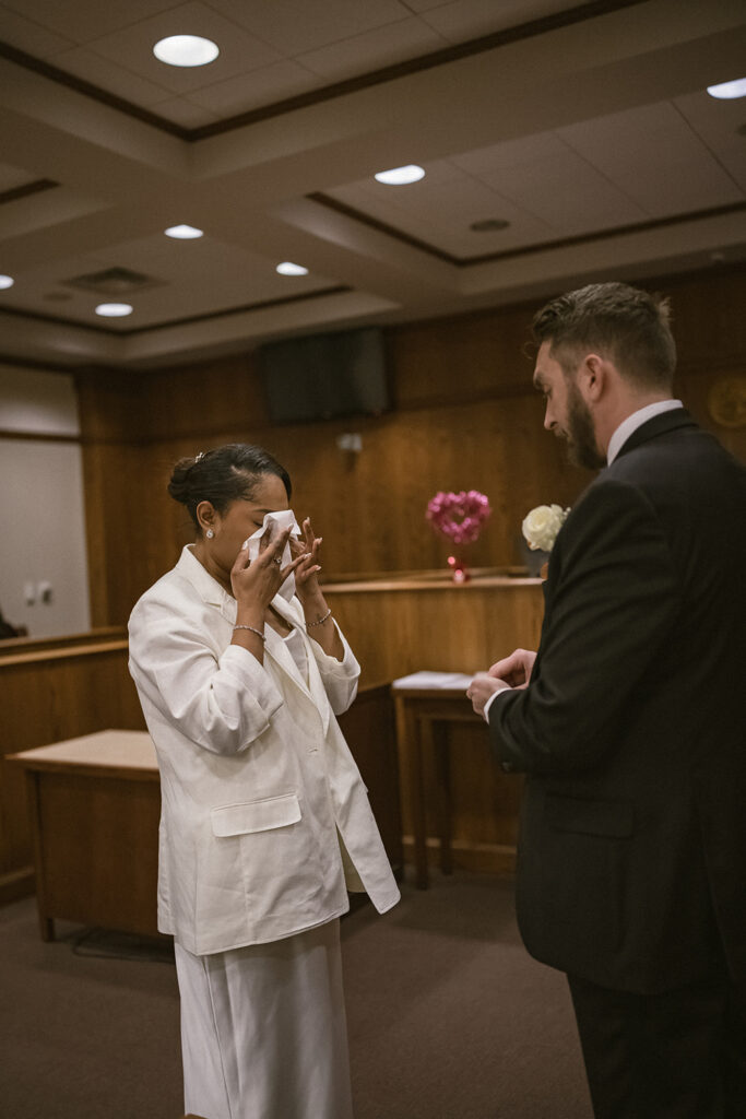 Bride becoming emotional during courthouse wedding vows in Champaign Illinois.